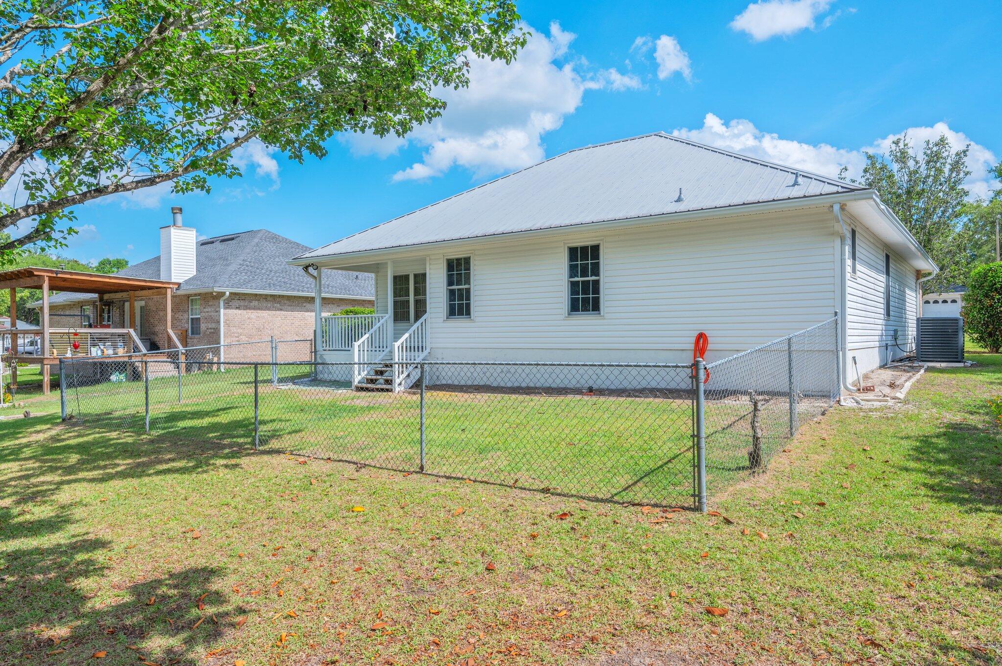 642 Alysheba Drive Crestview, FL 32539 - Photo 25 of 32 a view of a house with a backyard