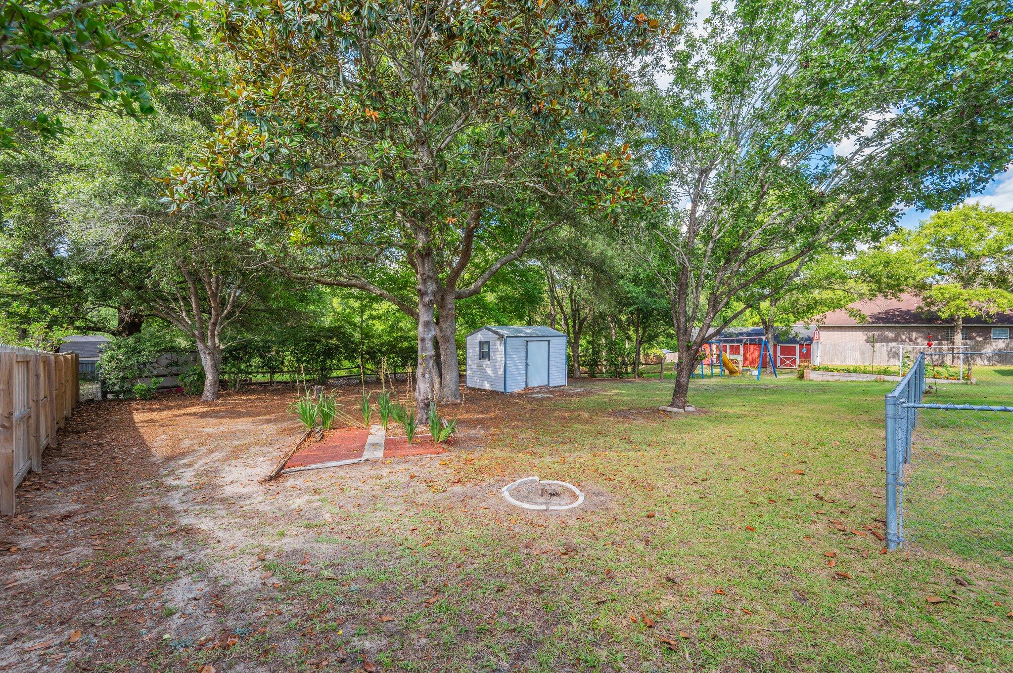 642 Alysheba Drive Crestview, FL 32539 - Photo 27 of 32 a view of a playground with a slide