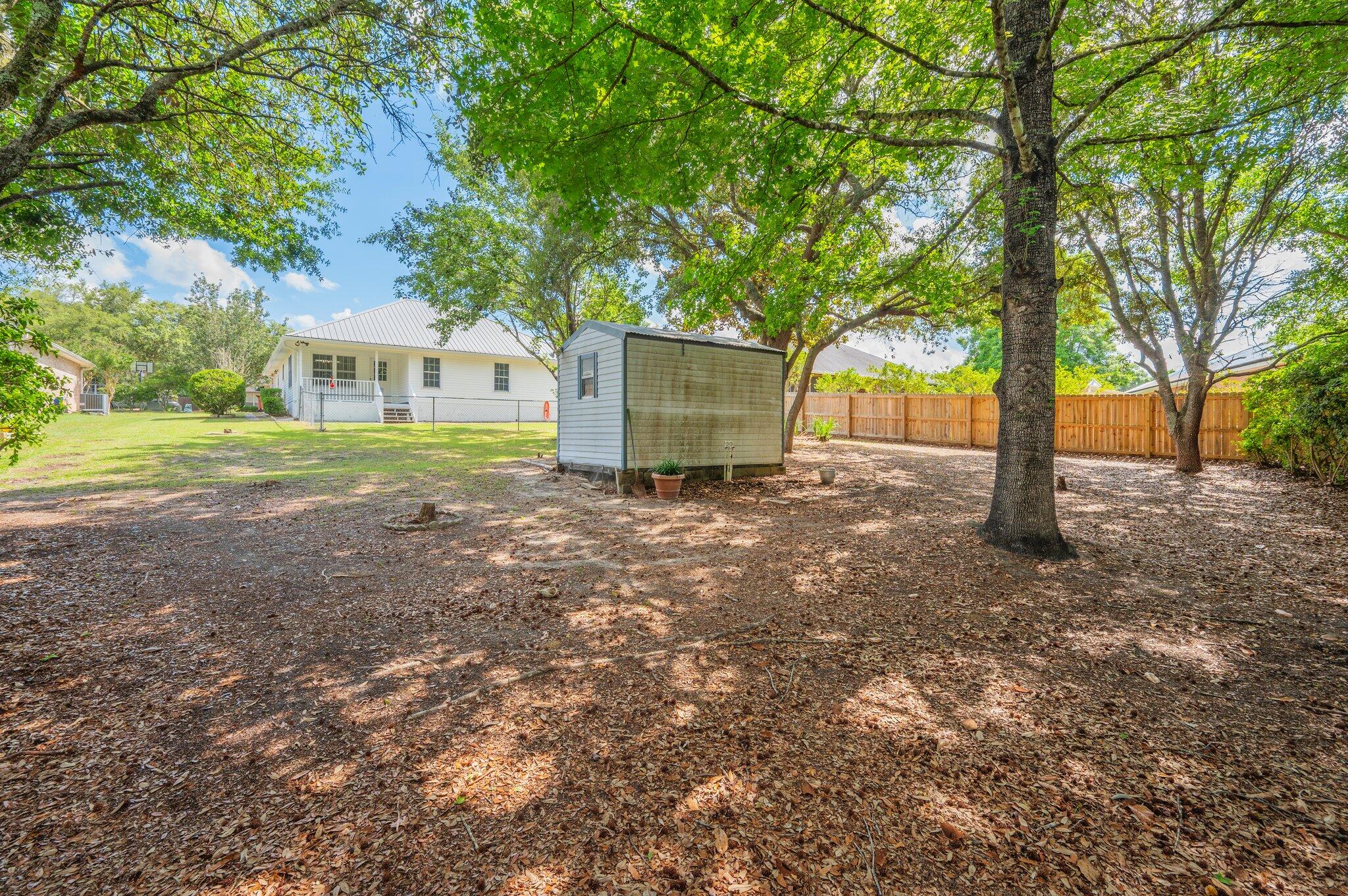 642 Alysheba Drive Crestview, FL 32539 - Photo 28 of 32 a view of a house with yard and tree s