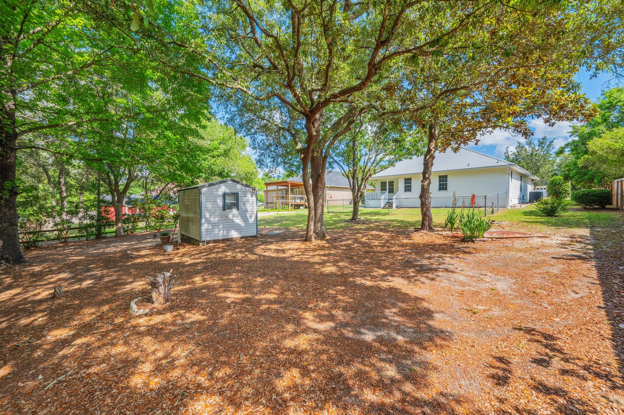 642 Alysheba Drive Crestview, FL 32539 - Photo 29 of 32 a front view of a house with a yard