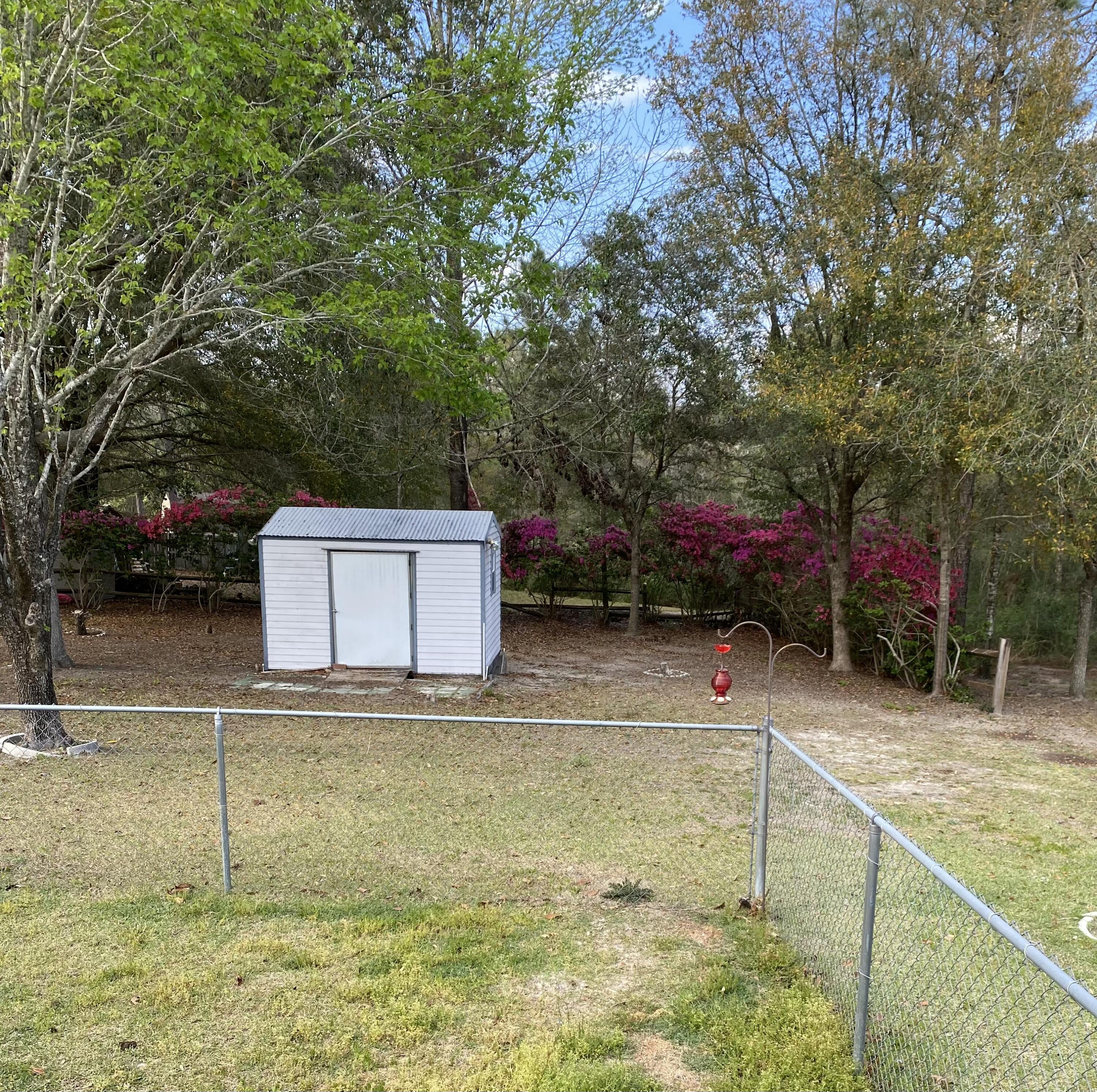 642 Alysheba Drive Crestview, FL 32539 - Photo 31 of 32 a view of a backyard