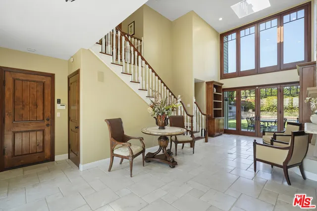 a living room with fireplace furniture and a flat screen tv