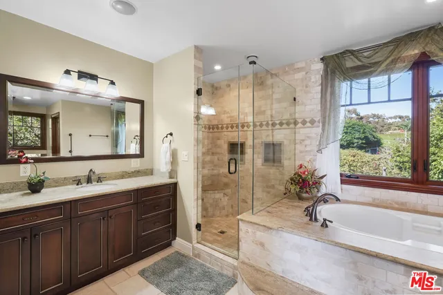 a living room with furniture large window and a fireplace