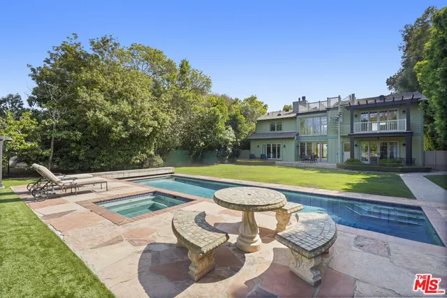 a view of an apartment with a swimming pool