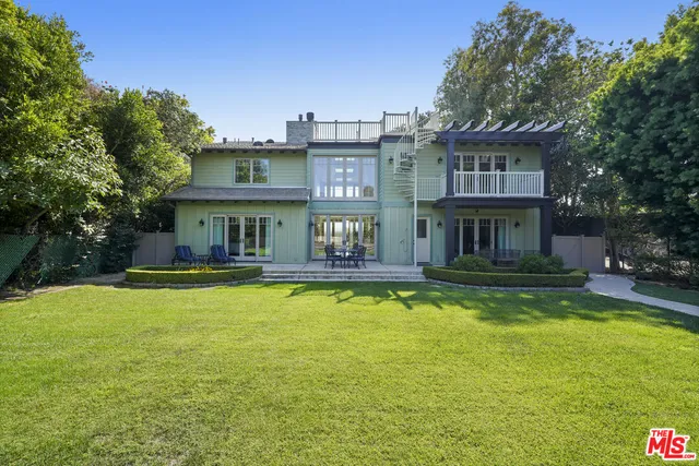 a view of a swimming pool with a yard