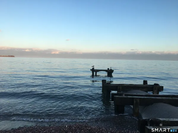 a view of a livingroom with couch and a window