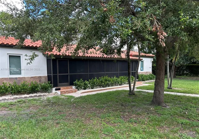 a spacious bedroom with a bed and a window