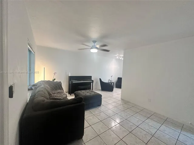 a view of house with backyard and a garden
