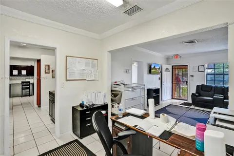 a kitchen with stainless steel appliances granite countertop a refrigerator and a stove