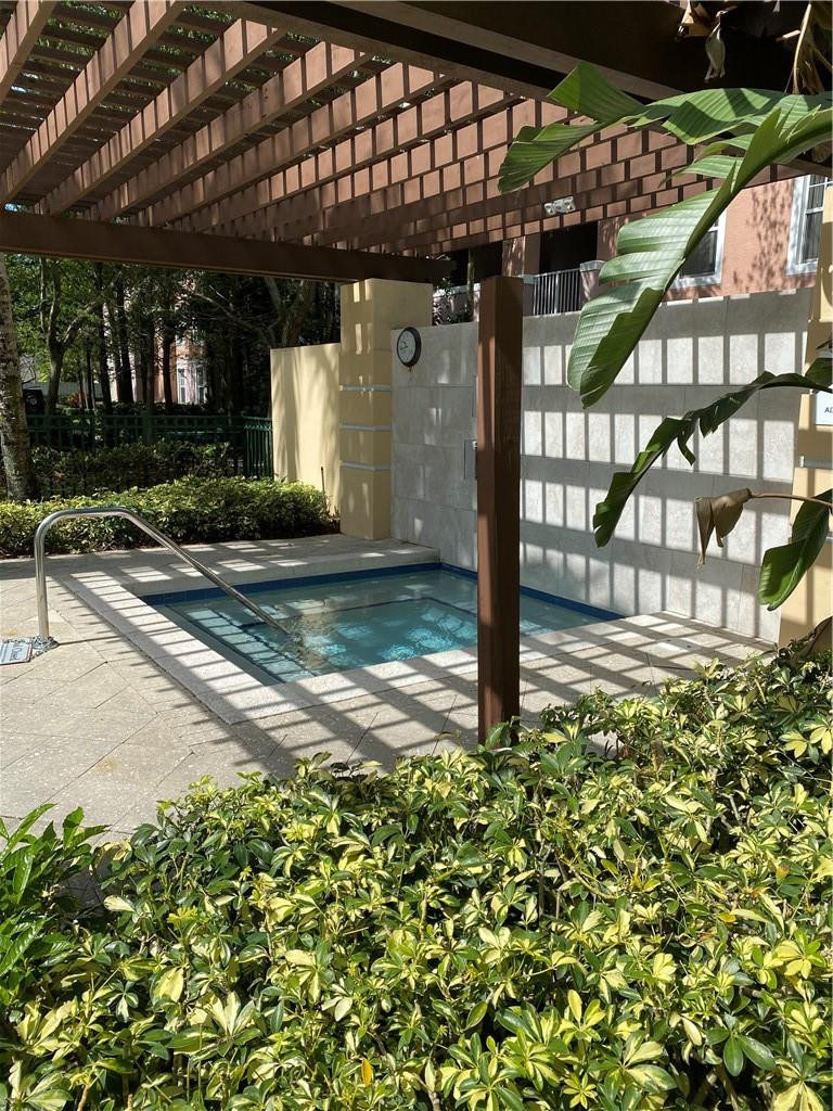 6820 West Sample Road, Unit 6820 Coral Springs, FL 33067 - Photo 13 of 13 a view of a house with a small yard