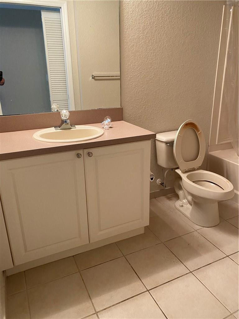 6820 West Sample Road, Unit 6820 Coral Springs, FL 33067 - Photo 4 of 13 a bathroom with a sink toilet and mirror