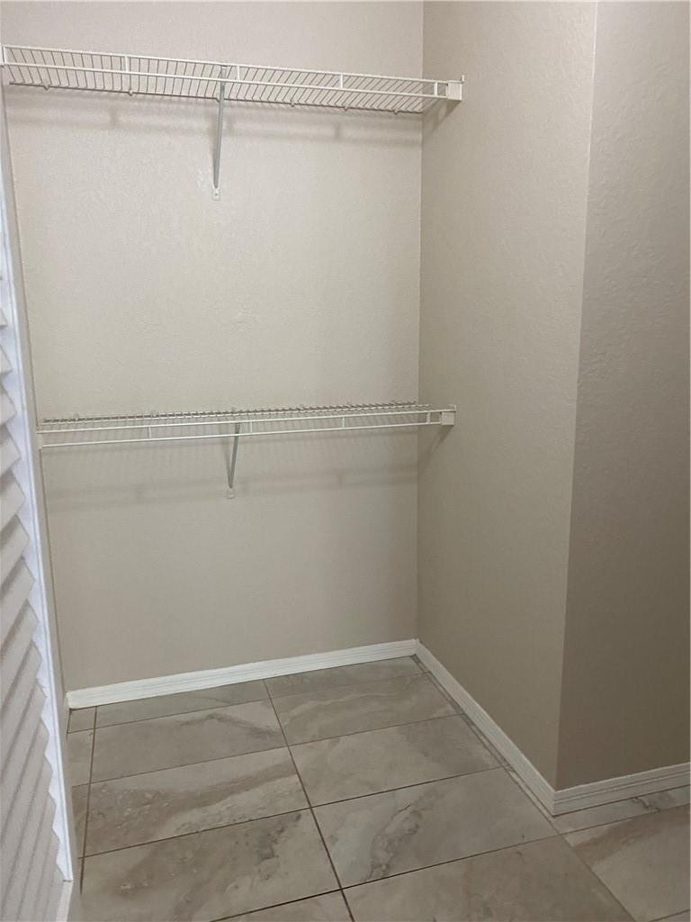 6820 West Sample Road, Unit 6820 Coral Springs, FL 33067 - Photo 6 of 13 a view of a room with racks on the wall