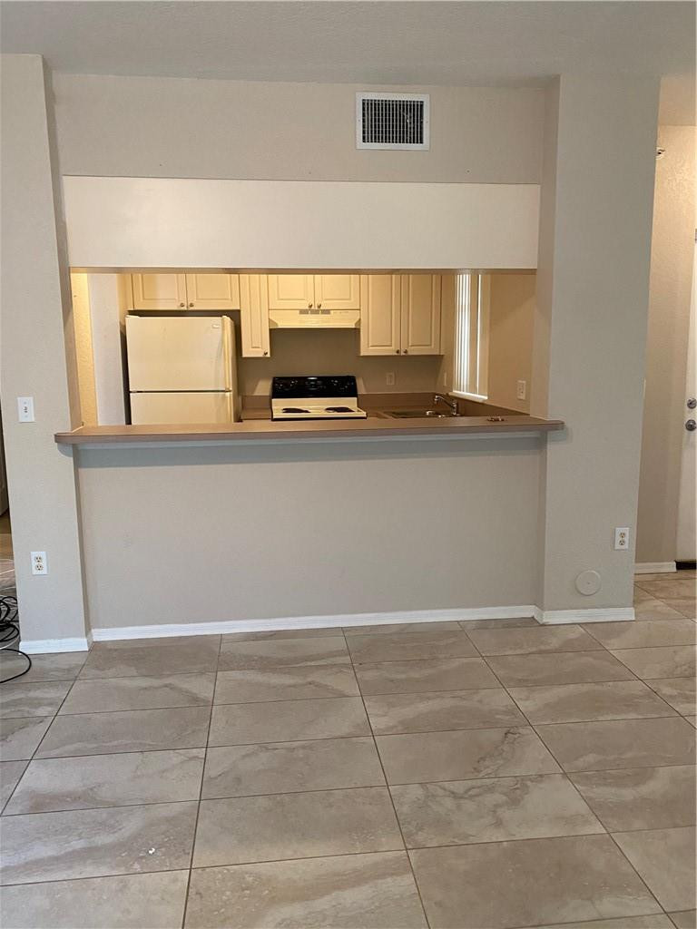 6820 West Sample Road, Unit 6820 Coral Springs, FL 33067 - Photo 8 of 13 a view of kitchen with microwave cabinets and window