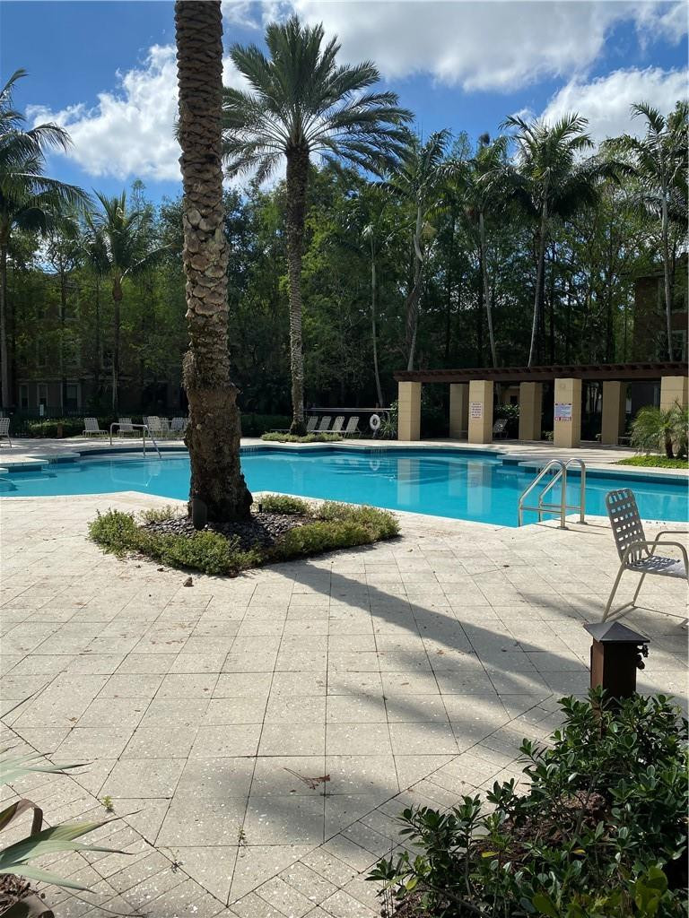 6820 West Sample Road, Unit 6820 Coral Springs, FL 33067 - Photo 10 of 13 a view of a backyard
