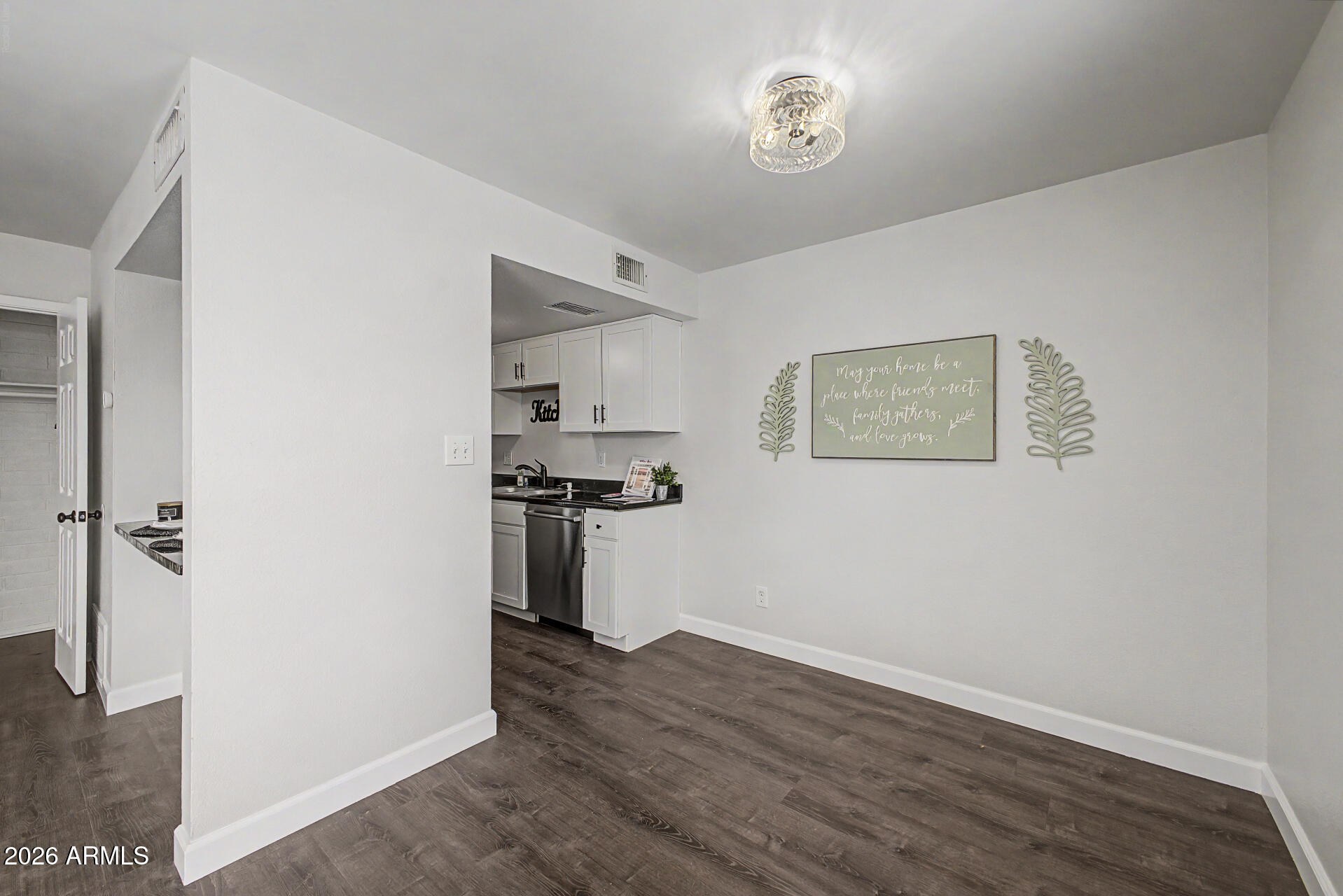 600 South Dobson Road, Unit 177 Mesa, AZ 85202 - Photo 7 of 24 a view of a kitchen from the hallway
