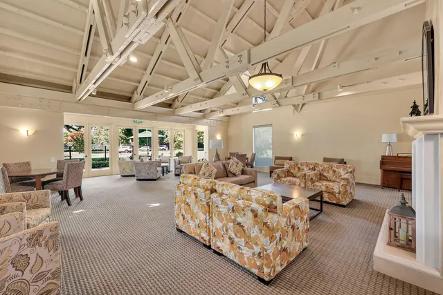 a living room with lots of furniture and a chandelier