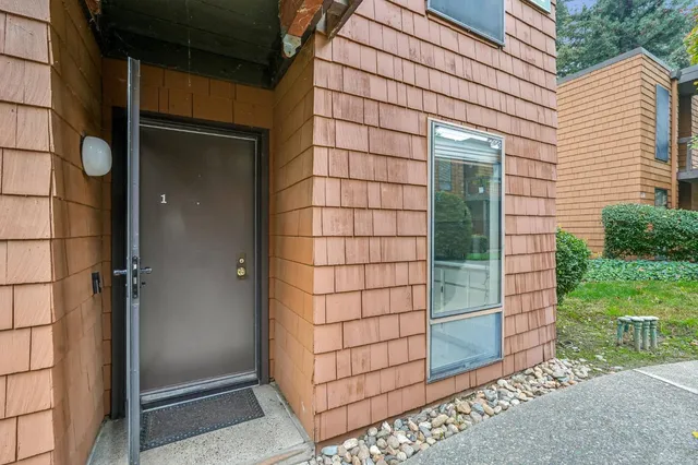 a view of a door and wooden floor