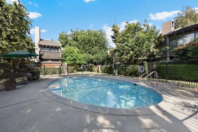 a view of a swimming pool with a patio
