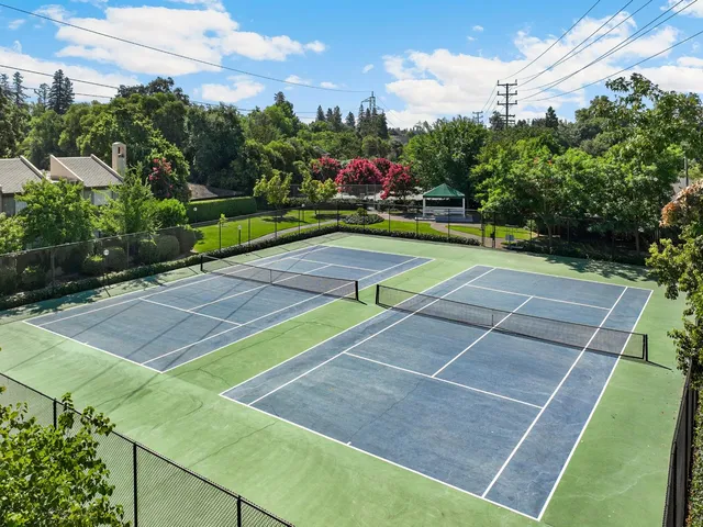a view of an outdoor space and tennis court
