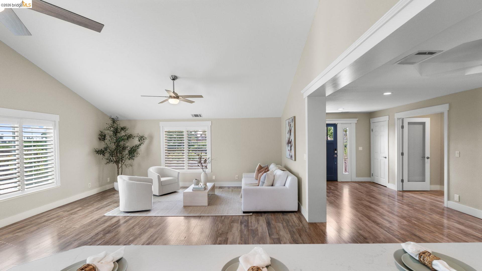 700 Brownstone Road Oakley, CA 94561 - Photo 17 of 58 Vaulted ceilings feature a ceiling fan and recessed lighting, enhancing the spacious living area