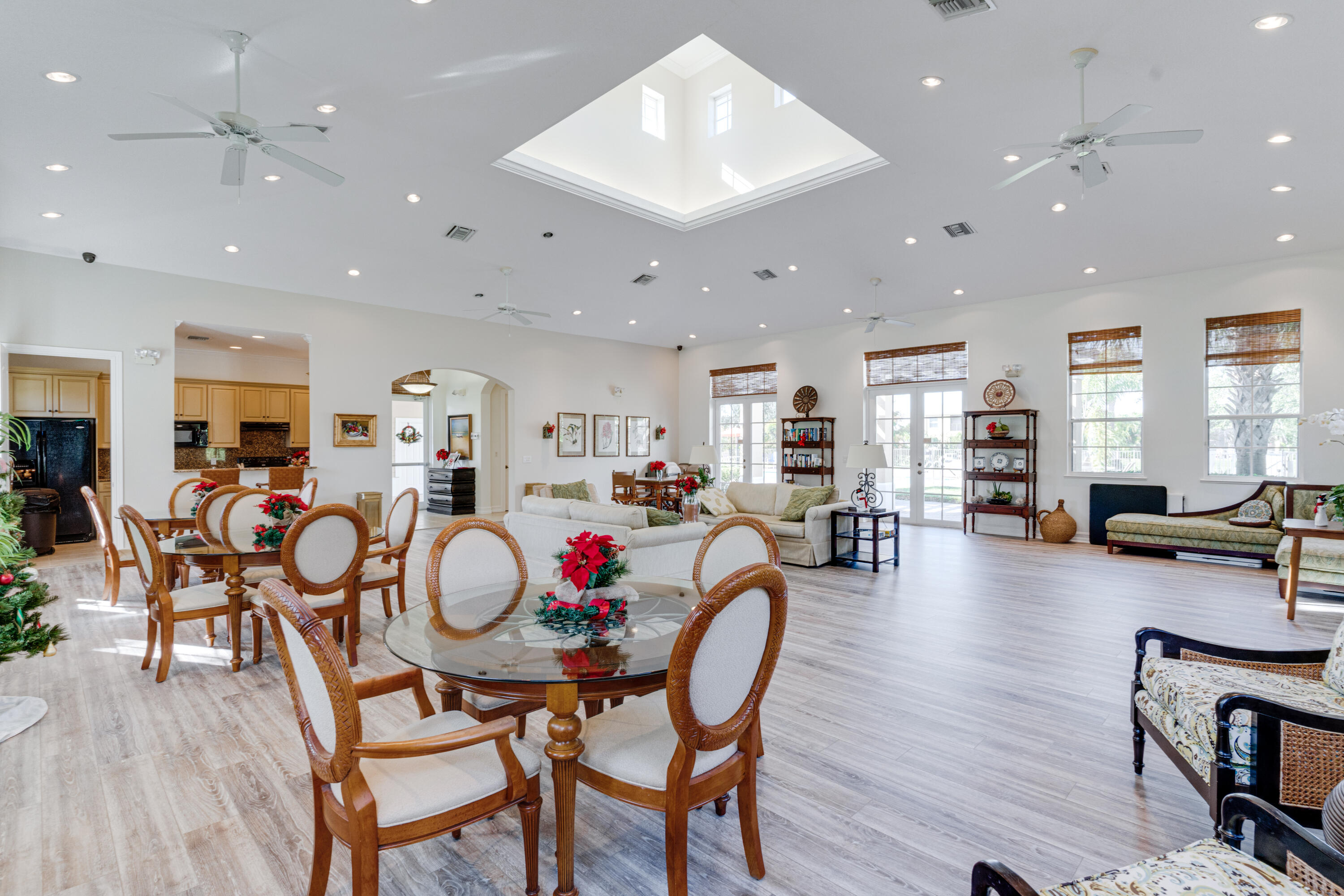 1805 Bridgepointe Circle, Unit 3 Vero Beach, FL 32967 - Photo 25 of 28 a view of a dining room with furniture and wooden floor