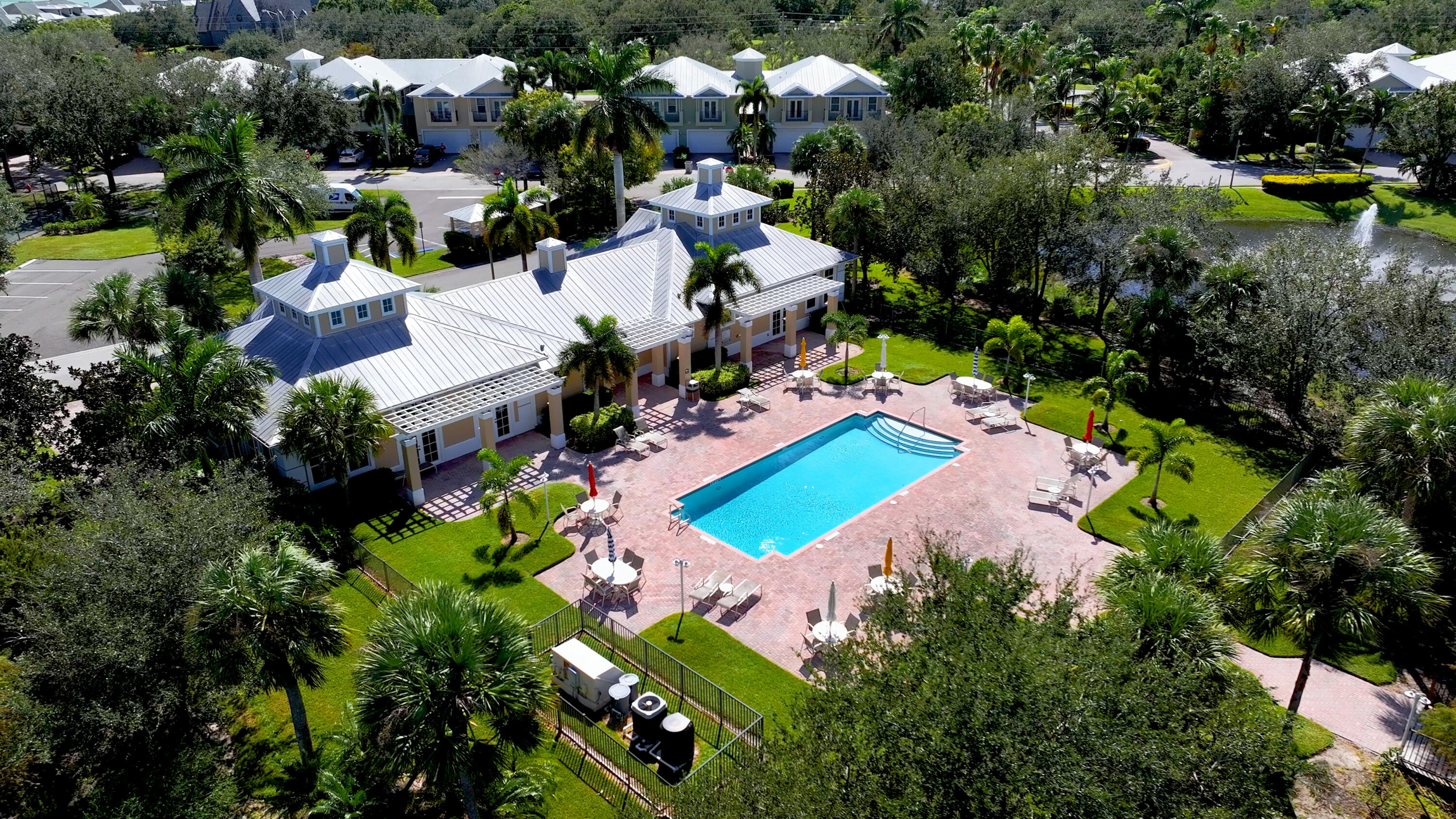 1805 Bridgepointe Circle, Unit 3 Vero Beach, FL 32967 - Photo 26 of 28 an aerial view of a house with a garden and swimming pool