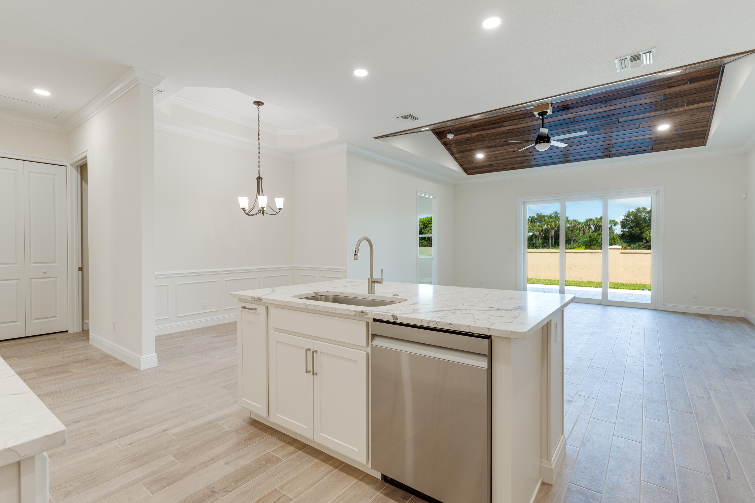 1805 Bridgepointe Circle, Unit 3 Vero Beach, FL 32967 - Photo 6 of 28 a kitchen with a sink a counter space and cabinets