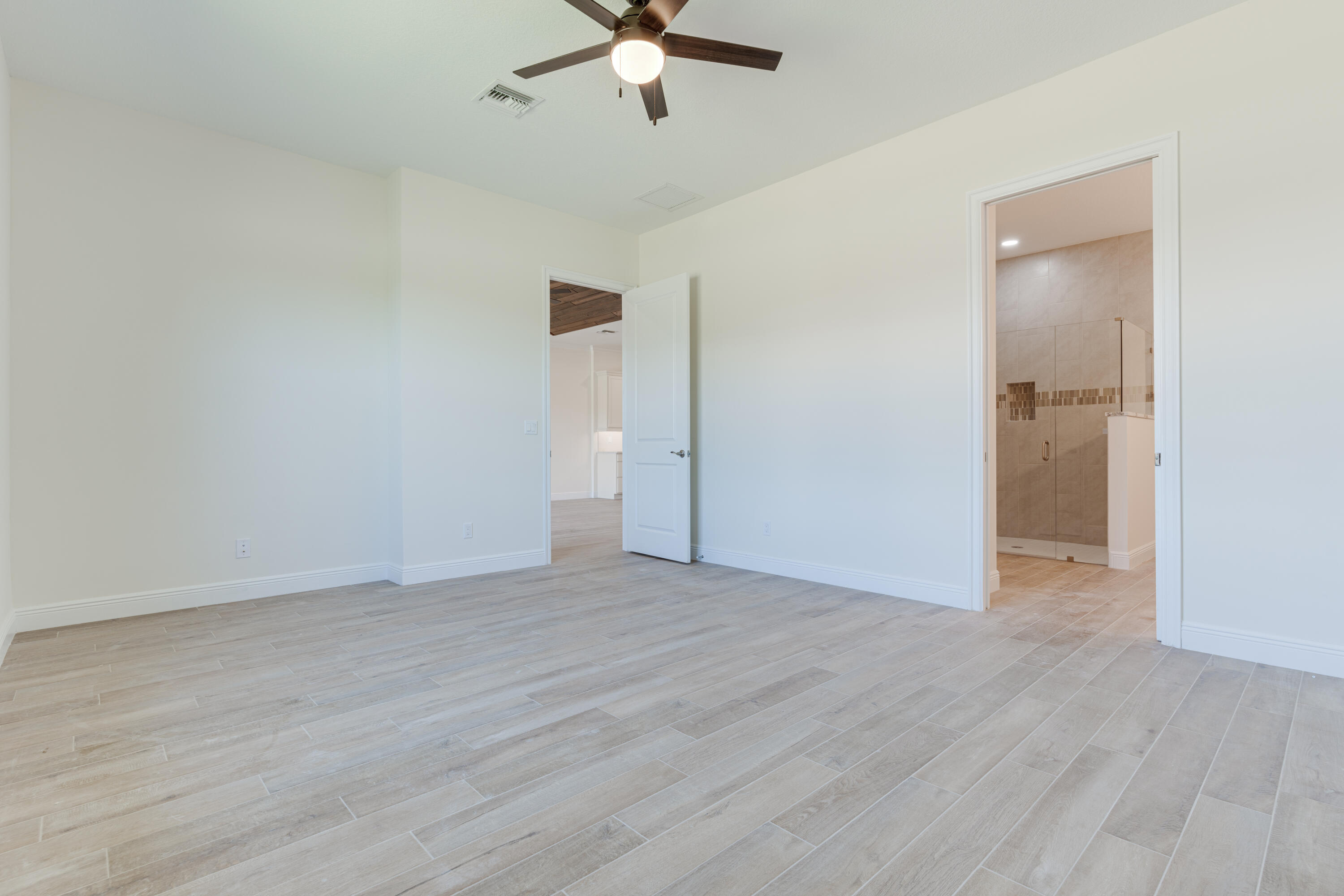 1805 Bridgepointe Circle, Unit 3 Vero Beach, FL 32967 - Photo 10 of 28 wooden floor in an empty room