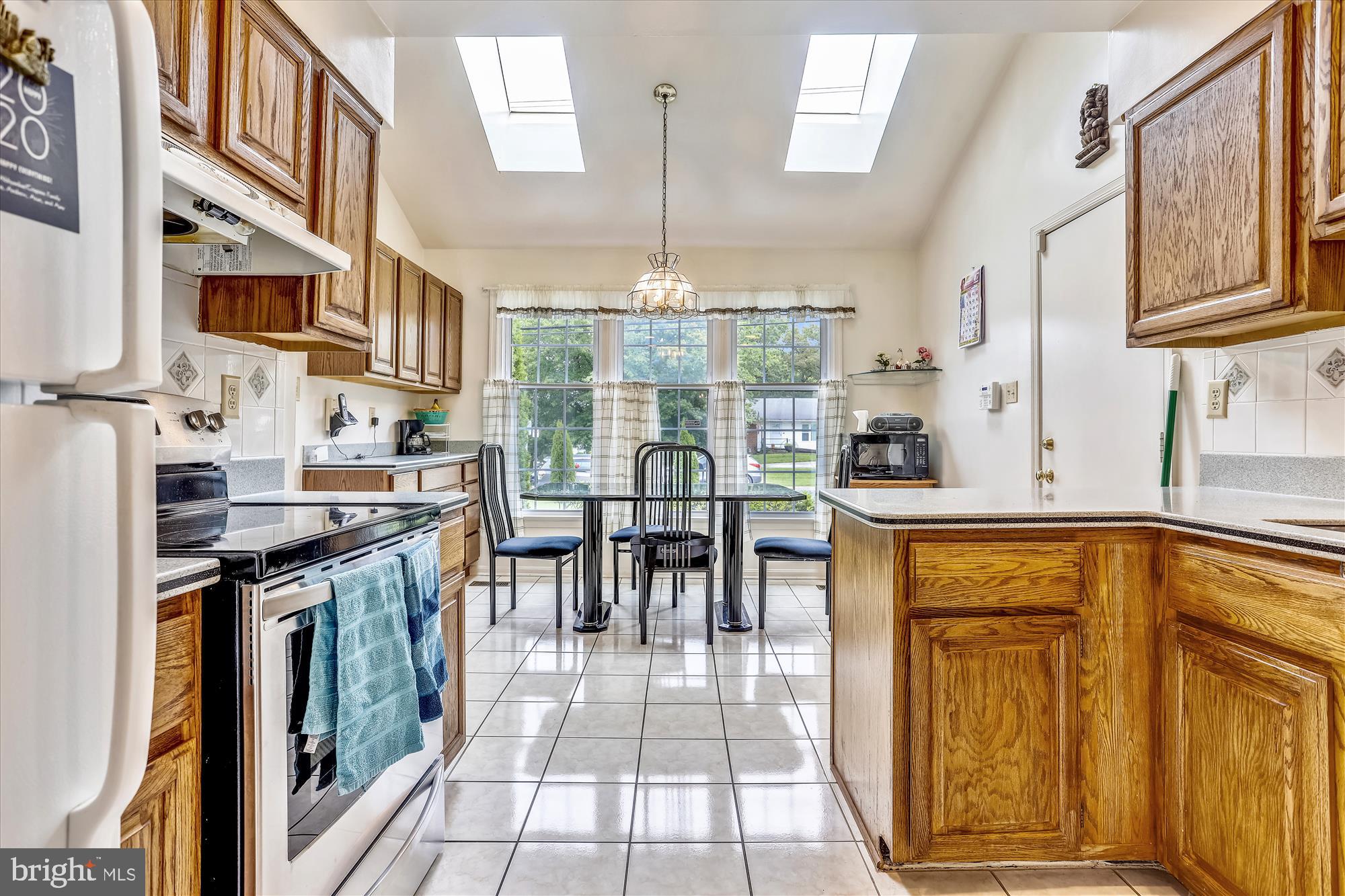 2943 Gracefield Road Silver Spring, MD 20904 - Photo 6 of 60 Kitchen with vaulted ceiling and skylights