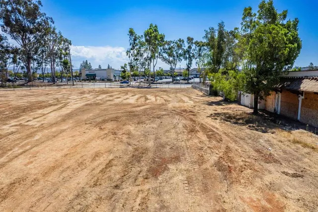 a view of swimming pool with outdoor seating and yard in the back