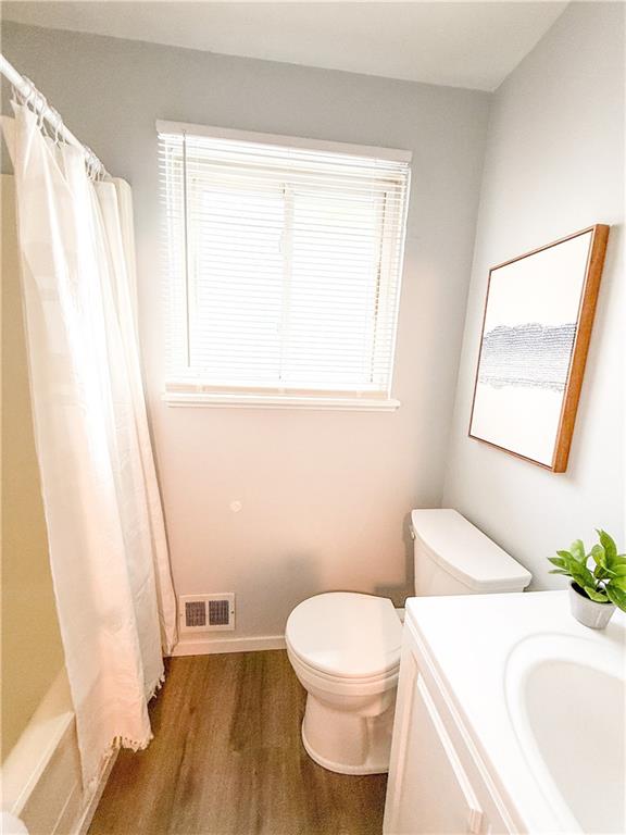 722 Mercer Street Pittsburgh, PA 15219 - Photo 18 of 41 a bathroom with a sink a toilet a window and a mirror