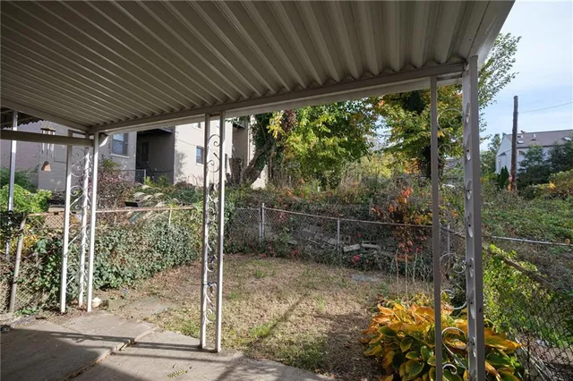 a backyard of a house with lots of green space