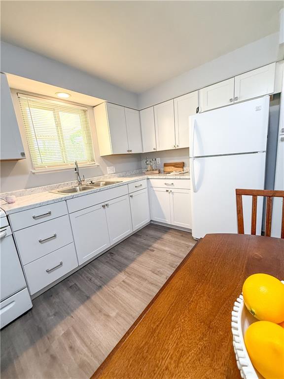722 Mercer Street Pittsburgh, PA 15219 - Photo 2 of 41 a kitchen with a sink a stove and cabinets