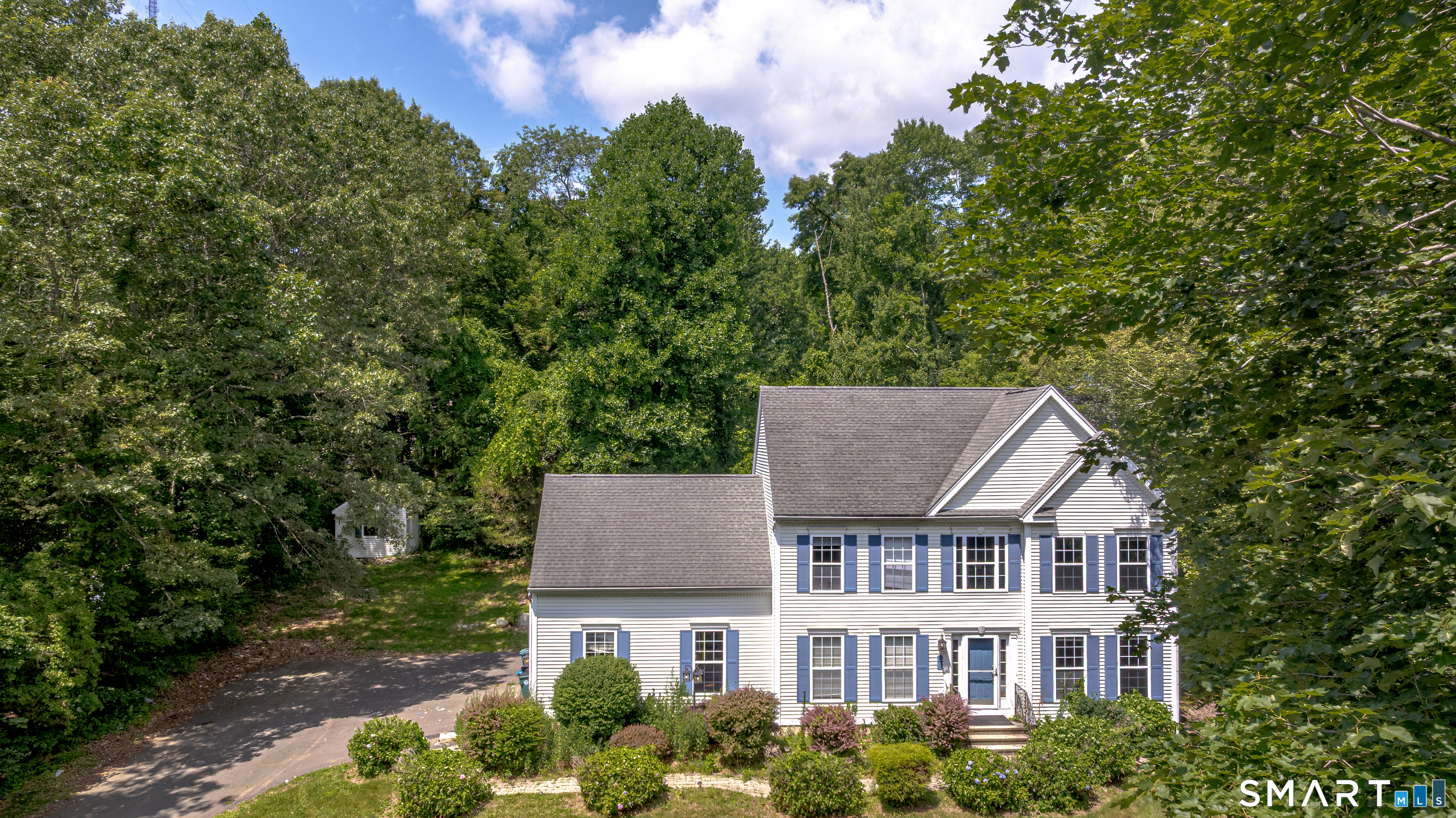 front view of a house with a garden