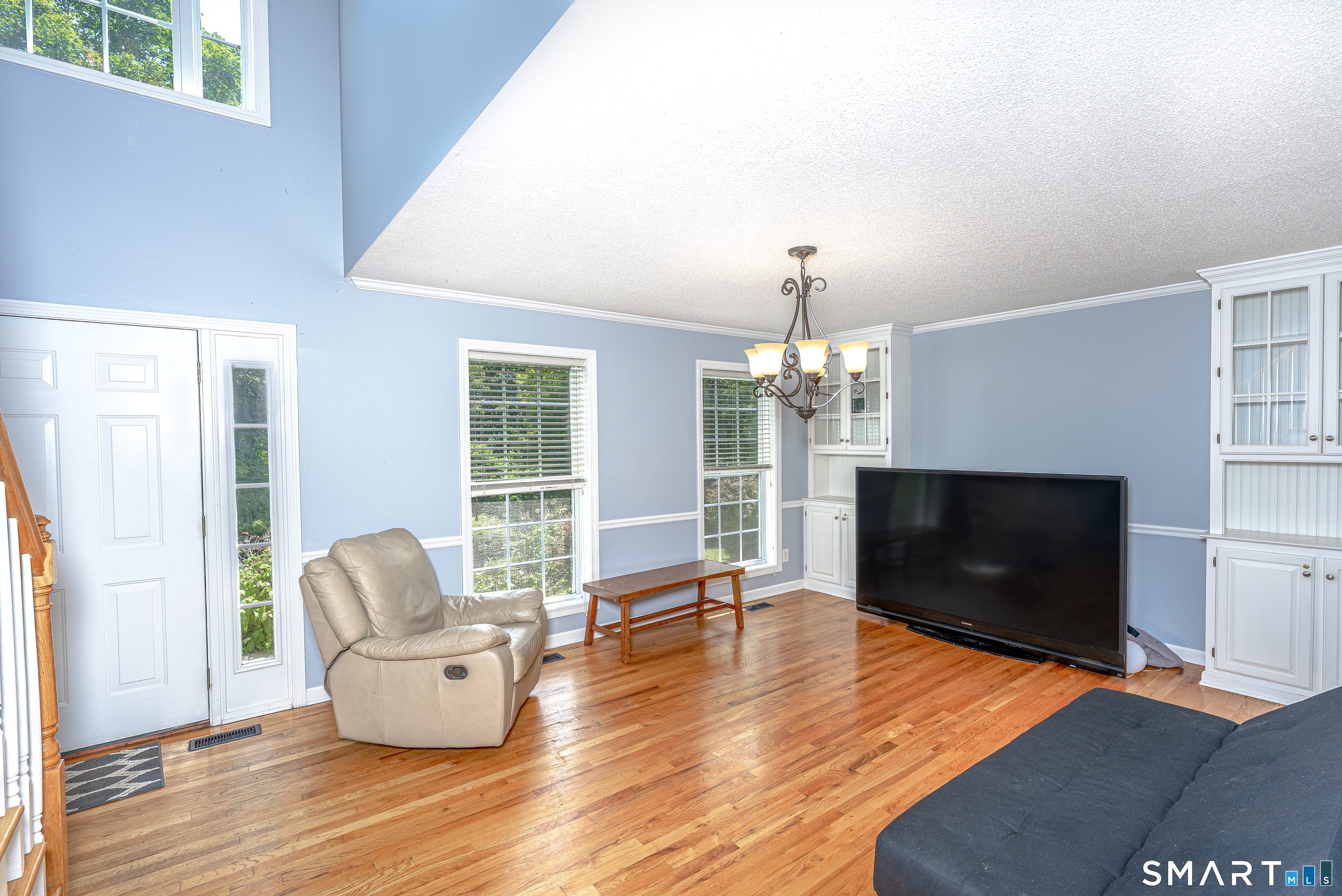 20 Gaylord Mountain Road Hamden, CT 06518 - Photo 12 of 37 a living room with furniture and a flat screen tv