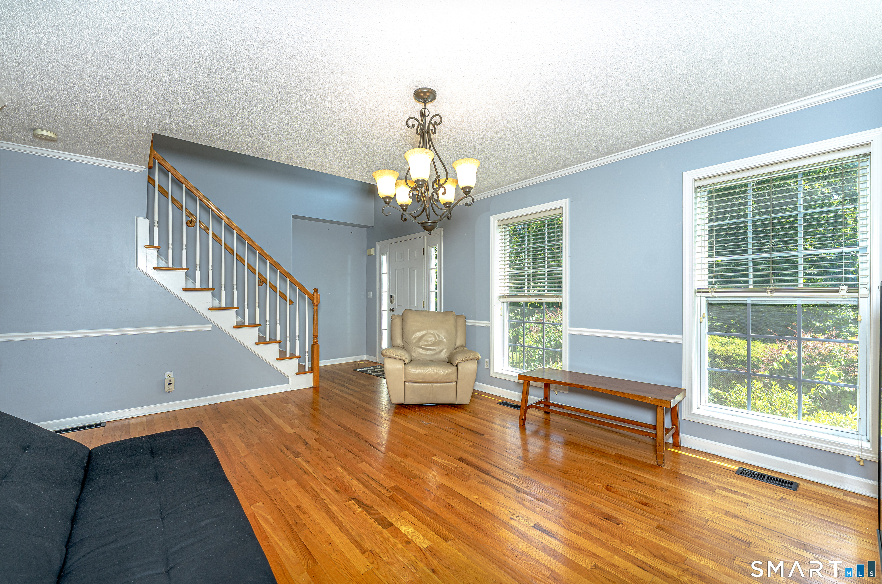 20 Gaylord Mountain Road Hamden, CT 06518 - Photo 13 of 37 a view of a livingroom with wooden floor and a swimming pool