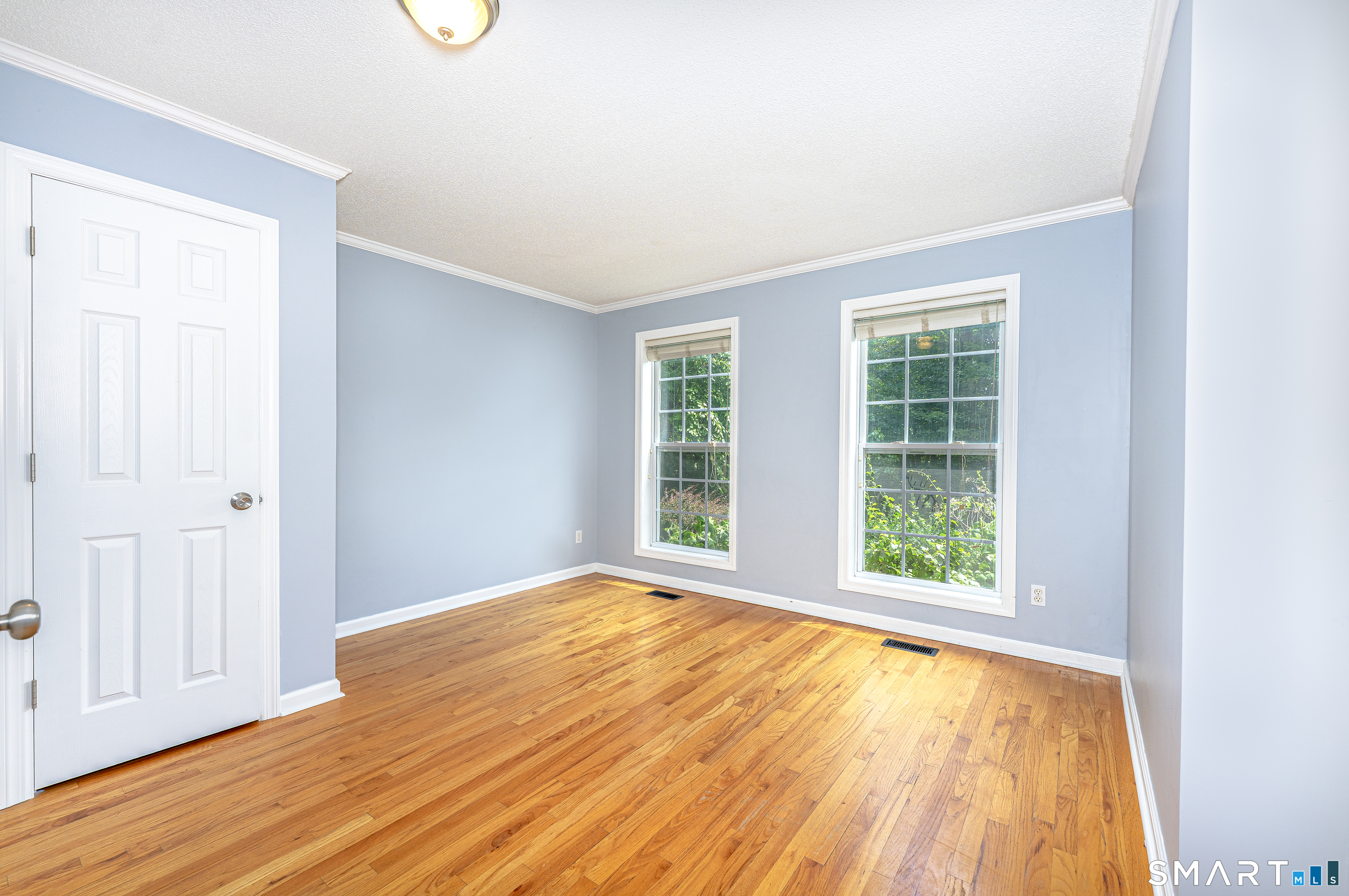 20 Gaylord Mountain Road Hamden, CT 06518 - Photo 14 of 37 an empty room with wooden floor and windows