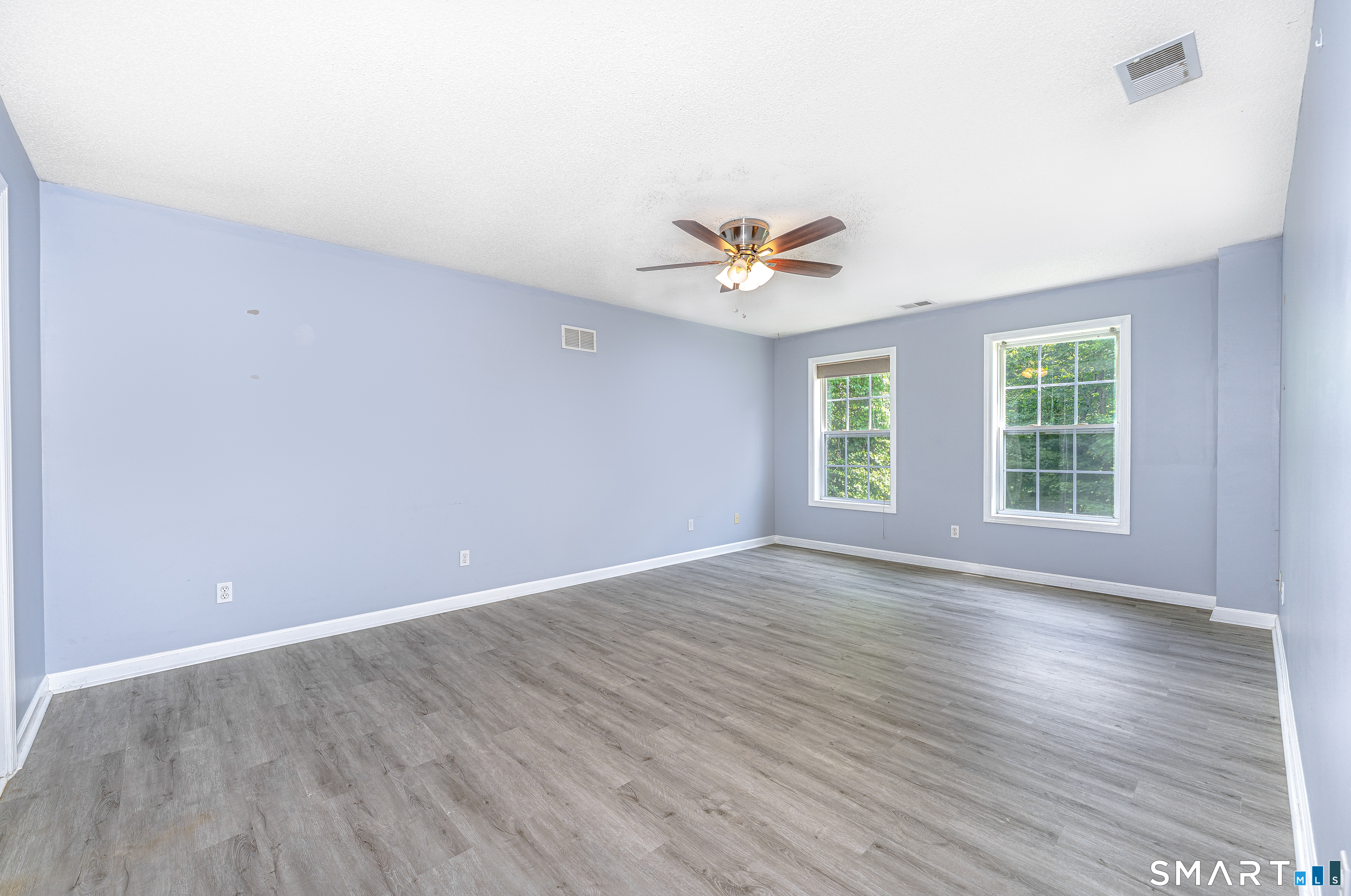 20 Gaylord Mountain Road Hamden, CT 06518 - Photo 23 of 37 an empty room with wooden floor and windows