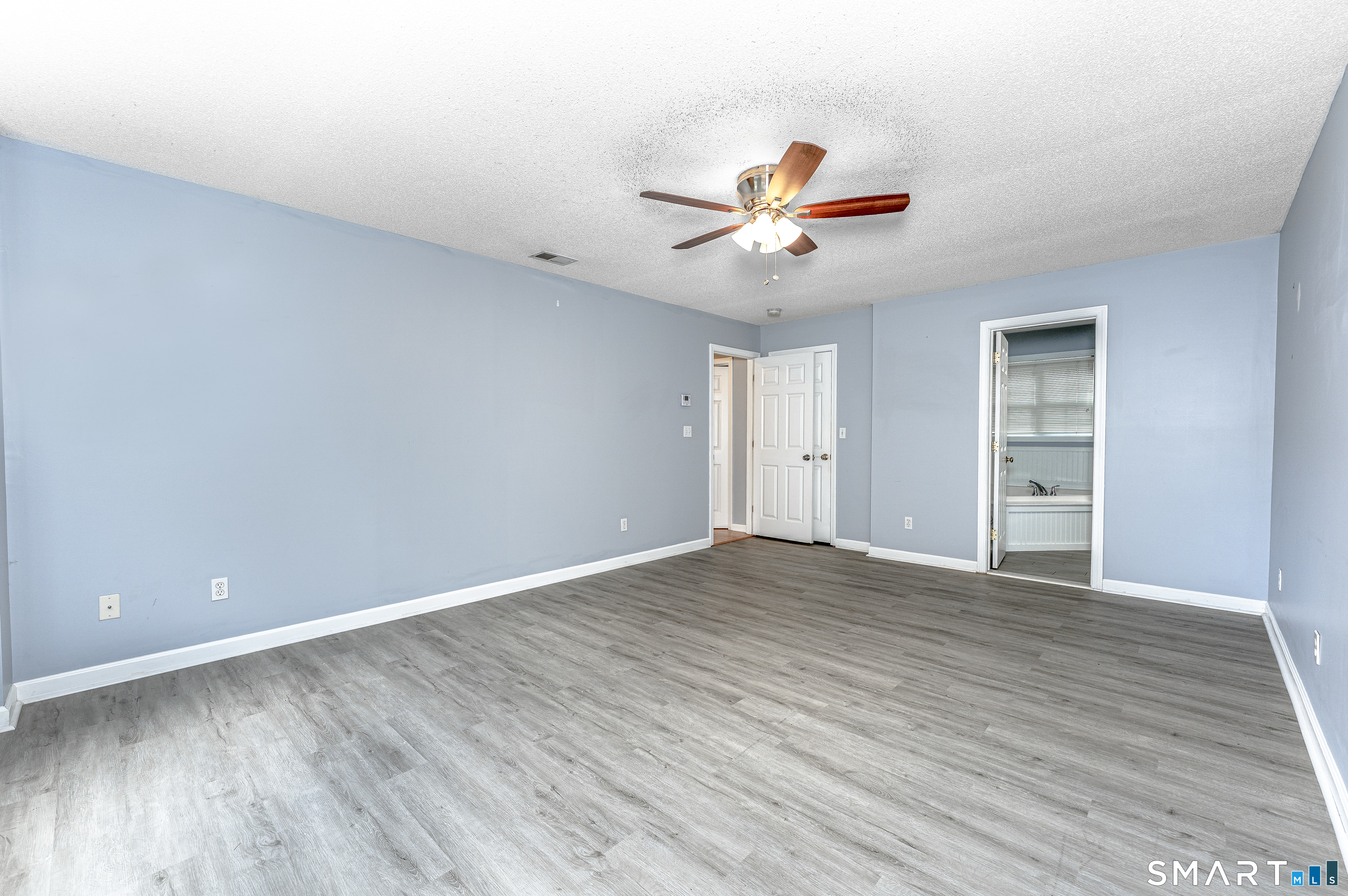 20 Gaylord Mountain Road Hamden, CT 06518 - Photo 24 of 37 a view of an empty room with a window and wooden floor