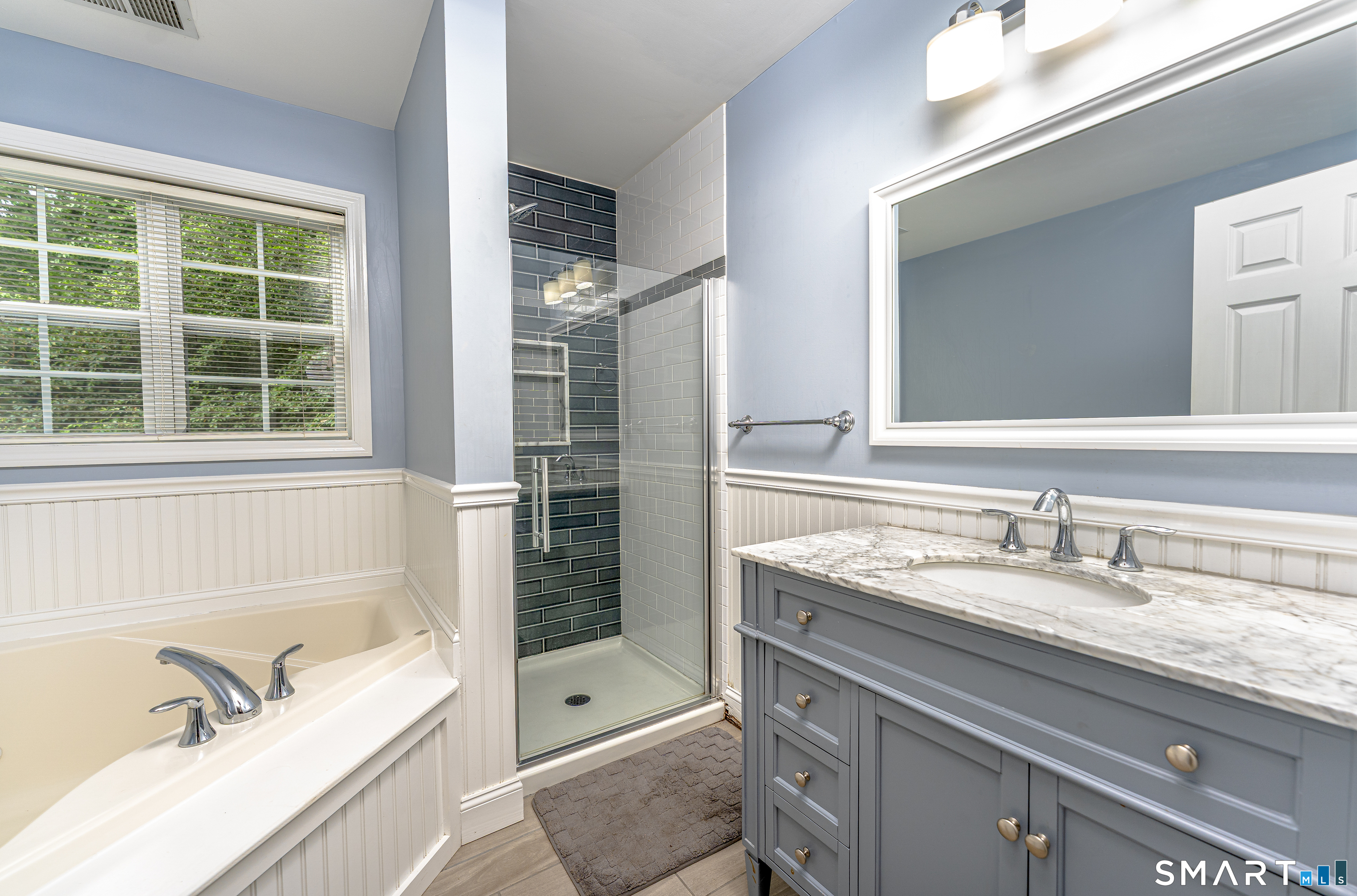 20 Gaylord Mountain Road Hamden, CT 06518 - Photo 25 of 37 a bathroom with a granite countertop tub sink a mirror and