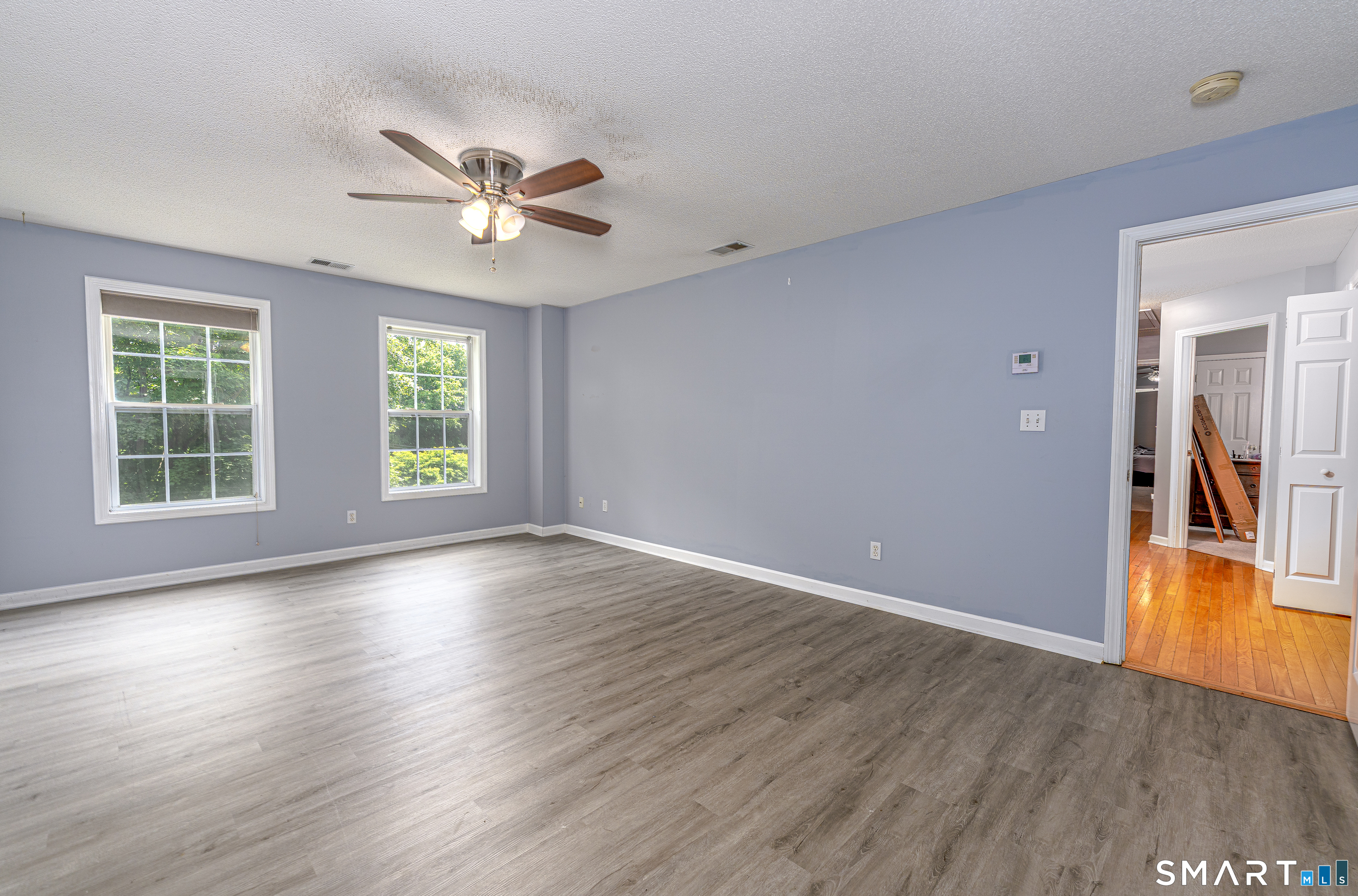 20 Gaylord Mountain Road Hamden, CT 06518 - Photo 27 of 37 a view of an empty room with window and wooden floor