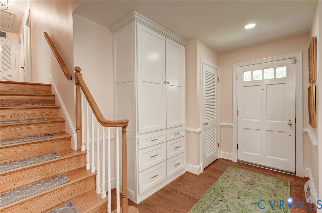 4287 Cheyenne Road Richmond, VA 23235 - Photo 23 of 60 a view of a hallway with closet and wooden floor