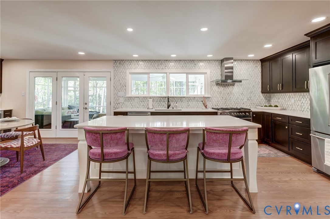 4287 Cheyenne Road Richmond, VA 23235 - Photo 25 of 60 a kitchen with stainless steel appliances granite countertop a table chairs sink and window
