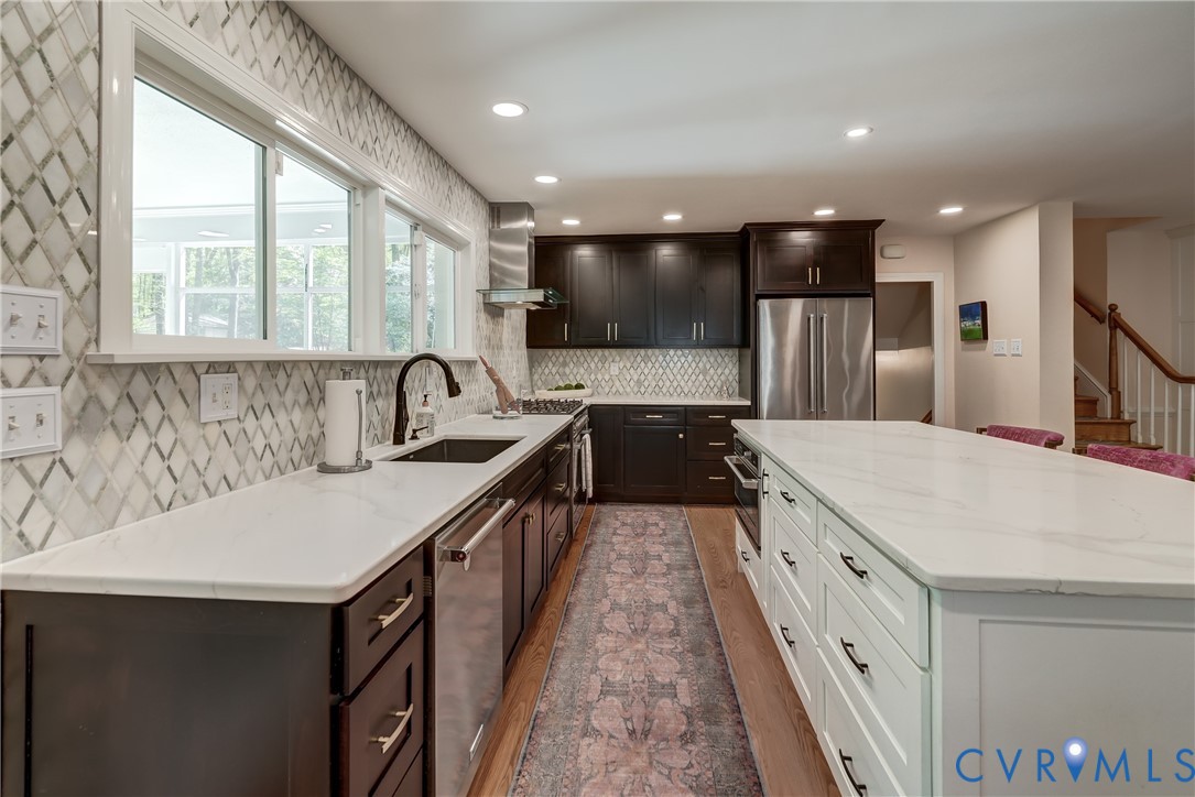 4287 Cheyenne Road Richmond, VA 23235 - Photo 27 of 60 a kitchen with granite countertop a sink and a stove top oven