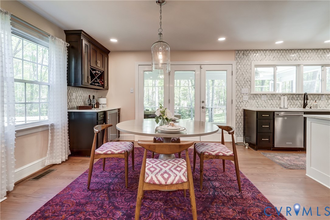 4287 Cheyenne Road Richmond, VA 23235 - Photo 33 of 60 a view of a a dining room with furniture window and wooden floor