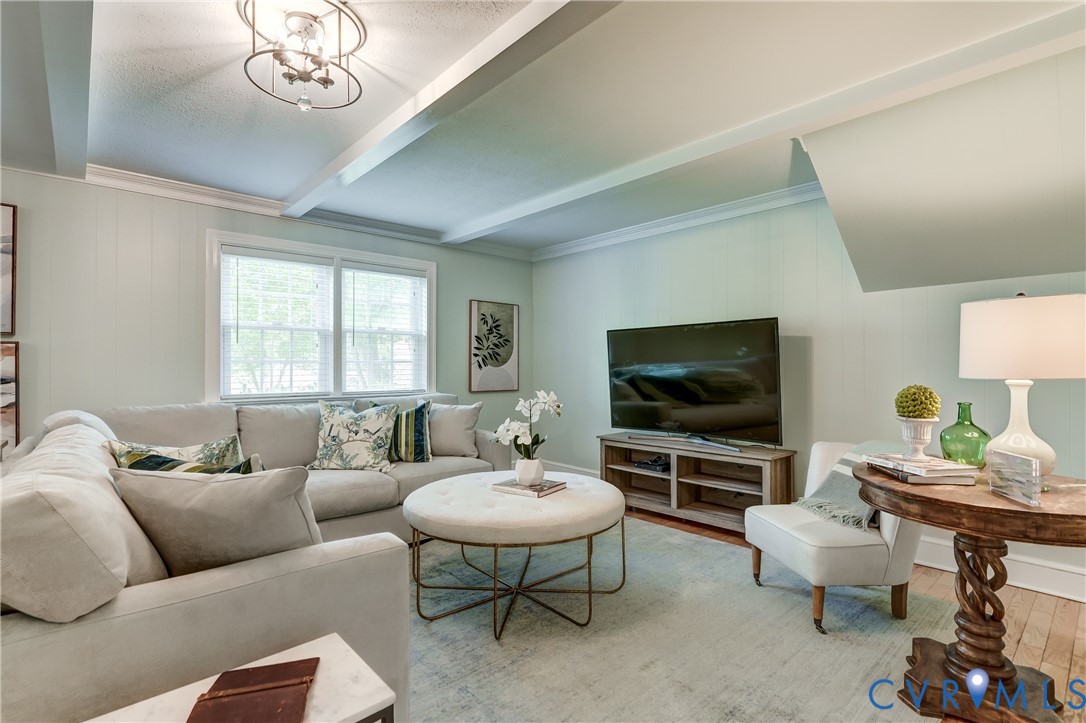 4287 Cheyenne Road Richmond, VA 23235 - Photo 40 of 60 a living room with furniture a flat screen tv and a window