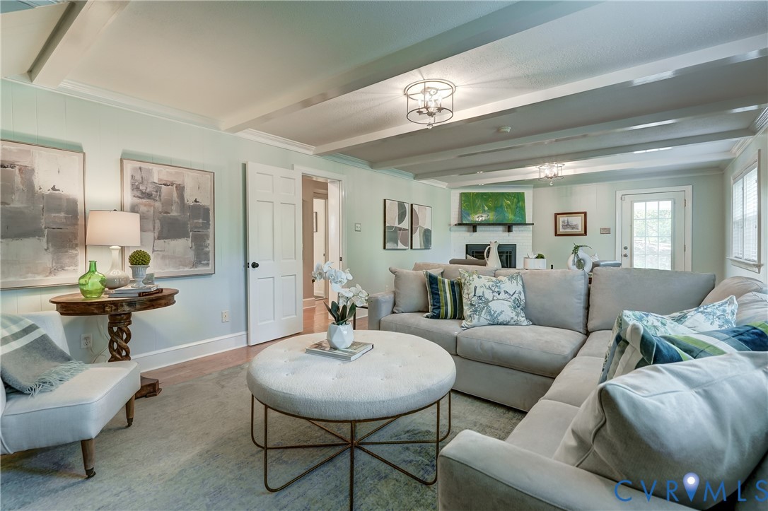 4287 Cheyenne Road Richmond, VA 23235 - Photo 41 of 60 a living room with furniture and a mirror