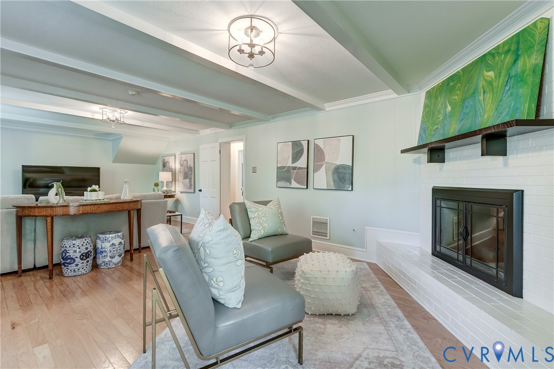 4287 Cheyenne Road Richmond, VA 23235 - Photo 43 of 60 a living room with furniture and a fireplace