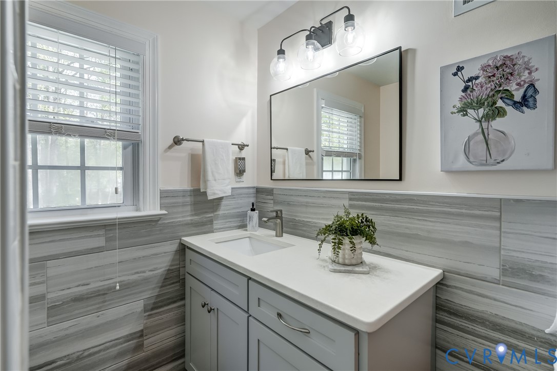 4287 Cheyenne Road Richmond, VA 23235 - Photo 56 of 60 a bathroom with a sink and a mirror