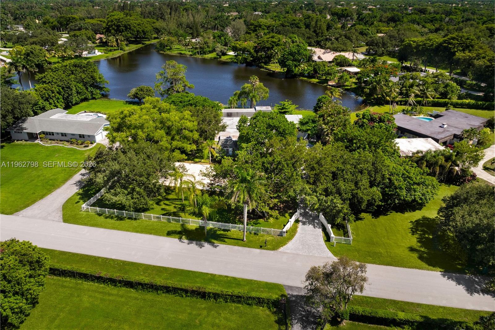 11000 Southwest 25th Street Davie, FL 33324 - Photo 40 of 45 an aerial view of residential houses with outdoor space and lake view